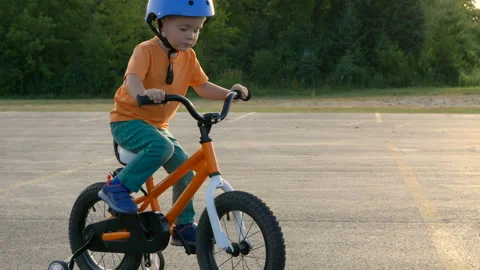Cute little boy ( two years old child) is riding bike Видео 113853298