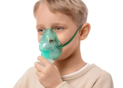 Cute little boy using nebulizer on white background, closeup Stock Photos
