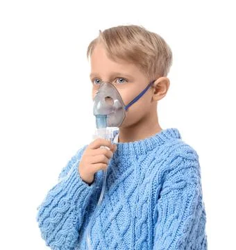 Cute little boy using nebulizer on white background Stock Photos