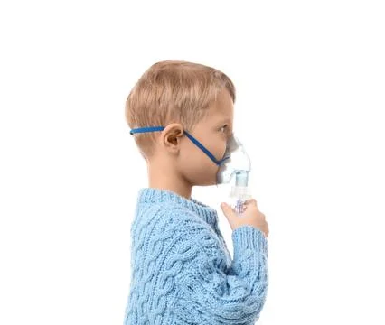 Cute little boy using nebulizer on white background Stock Photos