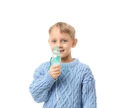 Cute little boy using nebulizer on white background Stock Photos