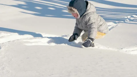 Cute little boy walking in winter. Snow, cold weather, outdoor activity Stock Footage 101501236
