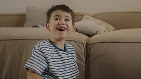 Cute little children playing while sitting on floor at home. Spend free time Stock Footage 260328592