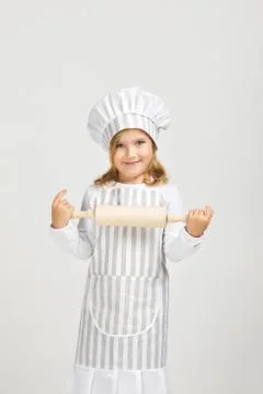 Cute little girl chef preparing healthy meal. Stock Photos
