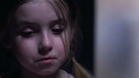 Cute little girl crying, scared of tyrant father, family violence victim closeup Video stock 107581908