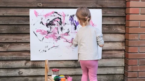 Cute little girl finger painting with va... | Stock Video | Pond5