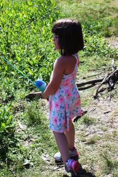 Cute Little Girl Fishing with a dress Stock Photos