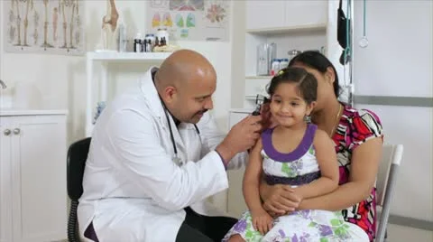 Cute little girl getting an ear checkup Stock Footage