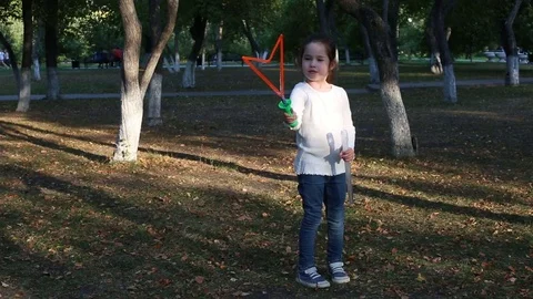 Cute little girl with large soap bubbles Stock Footage