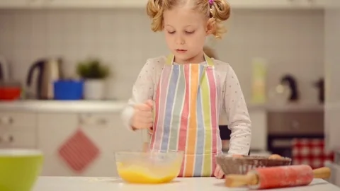 Cute little girl preparing Easter sweets Stock Footage 72203330