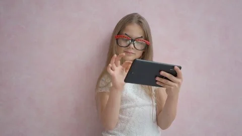 Cute little girl using tablet computer Stock Footage 69134352