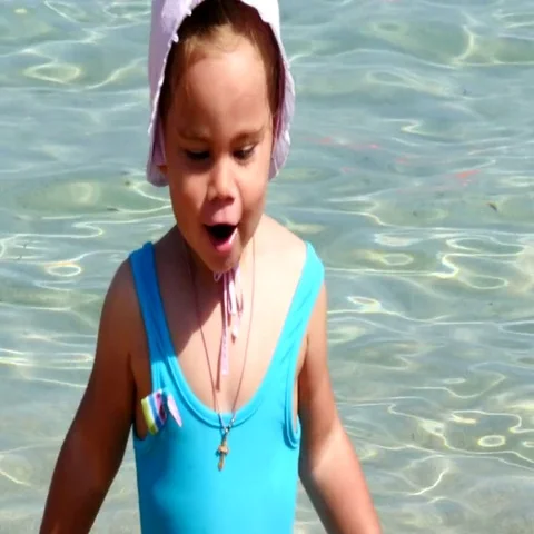 Cute little happy child playing in sea waves Stock Footage 69385809