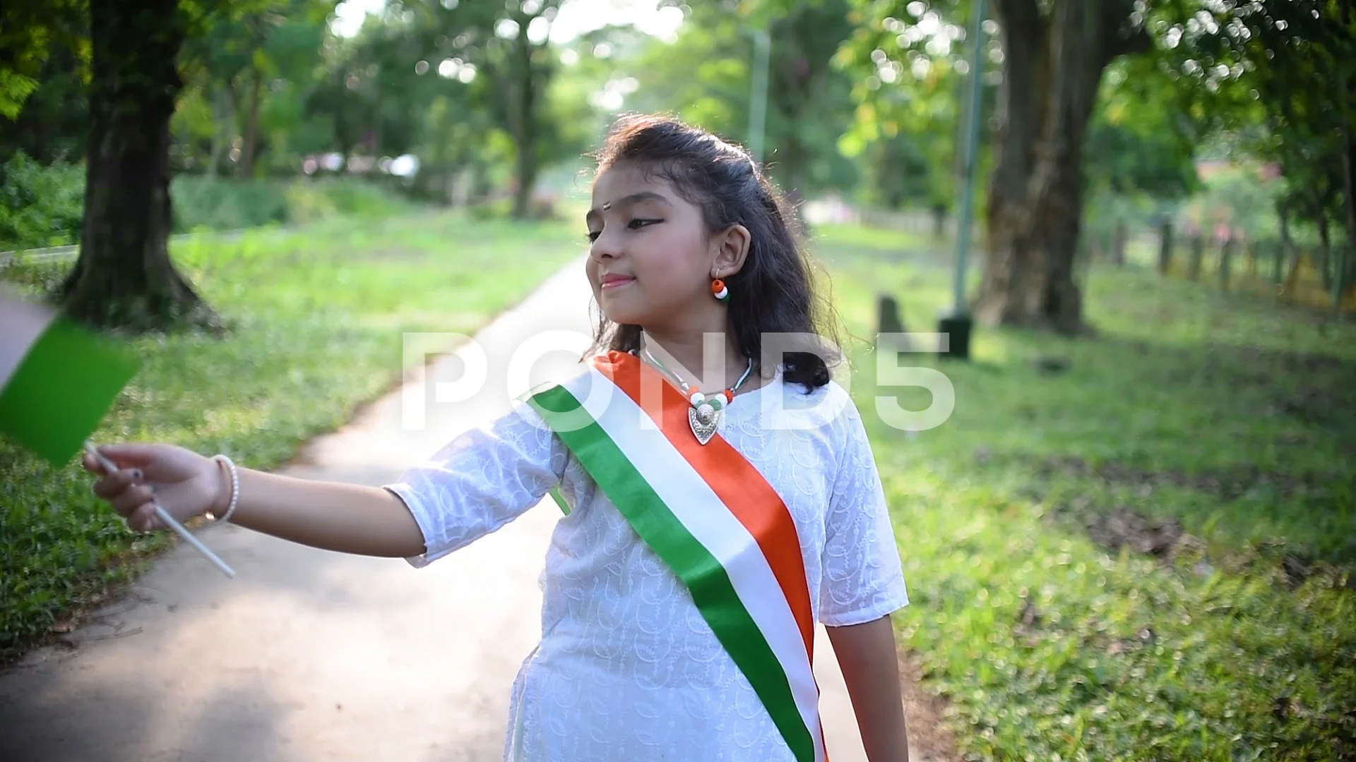 A cute little Indian girl holding the In... | Stock Video | Pond5