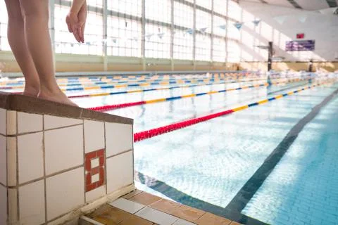 Cute little kid boy having rest after swimming in the sport swimming pool. Tr Stock Photos