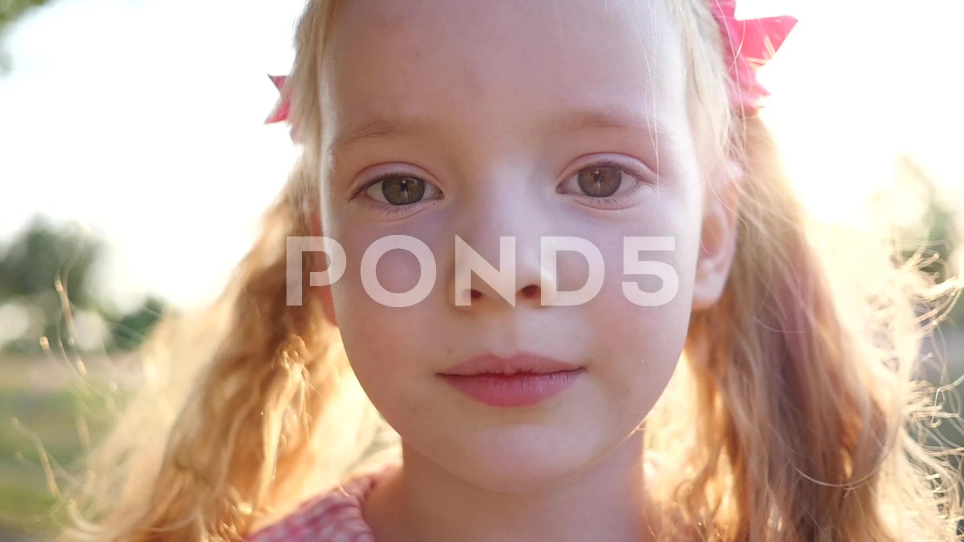 Cute Little Kid Girl Blonde Hair Face Portrait Pose To Camera In