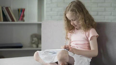 Cute little kid learning easily with interactive mobile app on gadget, education Stock Footage 85495264