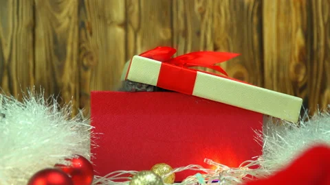 Cute little kitten gets out in a gift box with Christmas decoration. Stock Footage 119437868