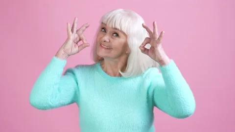 Cute lovely old granny make ok symbol promo isolated pastel color background Stock Footage 169287632