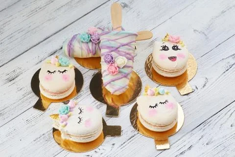 Cute macaroons with smiley faces Stock Photos