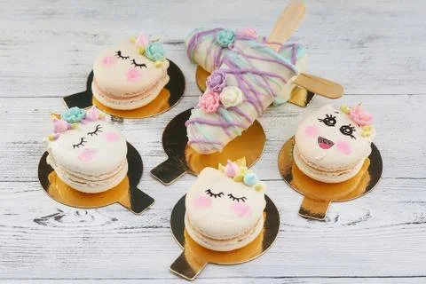 Cute macaroons with smiley faces Stock Photos