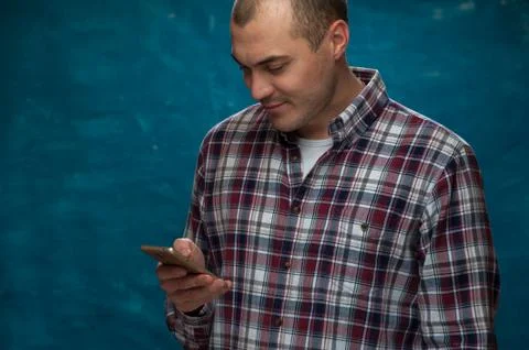 Cute man posing on blue background Stock Photos