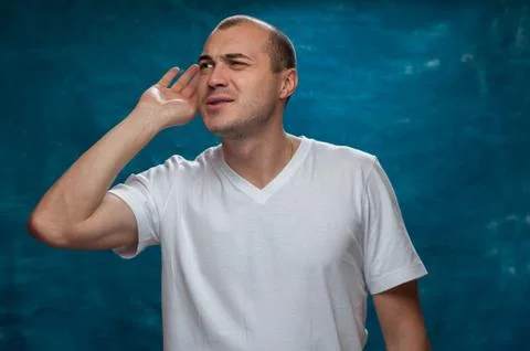 Cute man posing on blue background Stock Photos