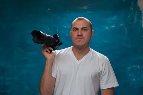 Cute man posing on blue background Stock Photos