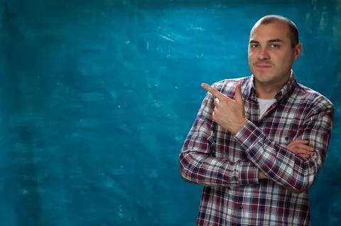 Cute man posing on blue background Stock Photos