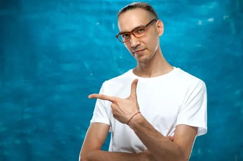 Cute man posing on blue background Stock Photos