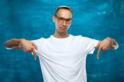 Cute man posing on blue background Stock Photos