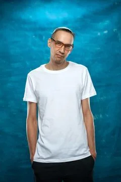 Cute man posing on blue background Stock Photos