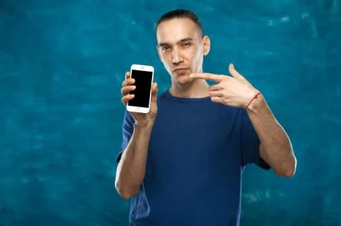Cute man posing on blue background Stock Photos