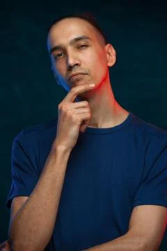 Cute man posing on blue background Stock Photos
