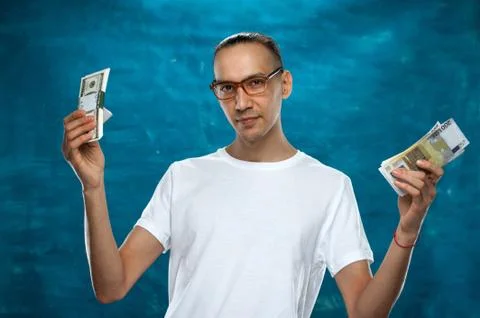 Cute man posing on blue background Stock Photos