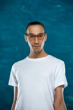 Cute man posing on blue background Stock Photos