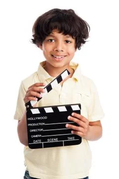 Cute mixed race boy with clapper board. Foto stock