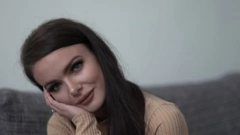 Cute model looking at the camera while r... | Stock Video | Pond5