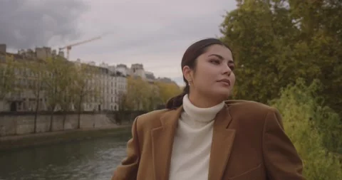 Cute model posing on overcast day in brown autumn coat, Paris, France Stock Footage 234177461