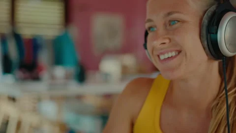 Cute modern woman work on computer in headphones Video stock 258149595