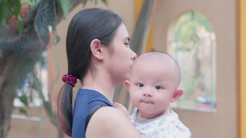 Cute, newborn Asian baby boy. Family happy, Asian young mother is playing, ca Video stock 218290953
