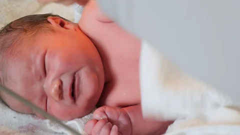 https://images.pond5.com/cute-newborn-baby-girl-getting-footage-089674984_iconl.jpeg