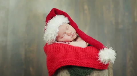 Cute newborn child in Christmas hat sleeping Stock Footage 59108584