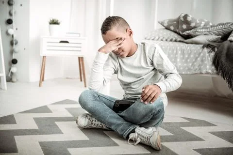 Cute nice boy closing his eye from tiredness Stock Illustration