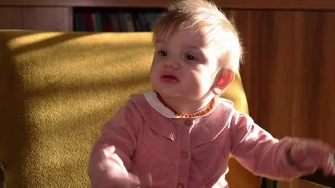 Cute one year old baby girl in living room. Stock Footage 301199537