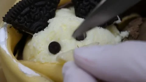Cute Panda-Shaped Ice Cream Dessert Wrapped in a Crepe Stock-Footage 345657053