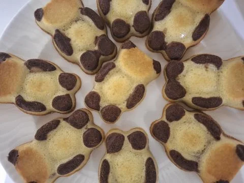 Cute Panda-Shaped Mini Cakes on White Plate Homemade Animal Baked Treats Stock Photos