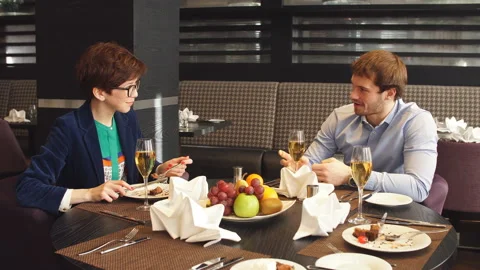 Cute partners making sollution at the cafe Stock Footage 102583231