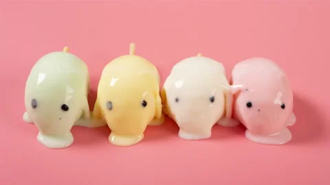 Cute pig shape colorful popsicles melting timelapse on a pink background Stock Footage 196684999