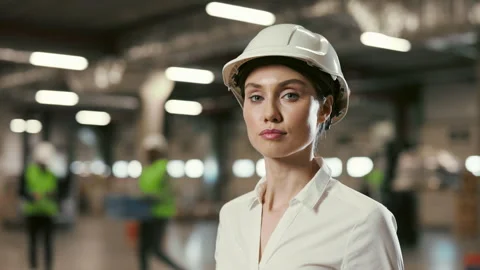 Cute Positive Lady Manager Looking at the Camera Standing Inside in the Stock Footage 248082418