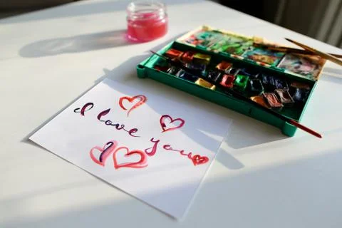 Cute postcard with declaration of love in calligraphic style res Stock Photos